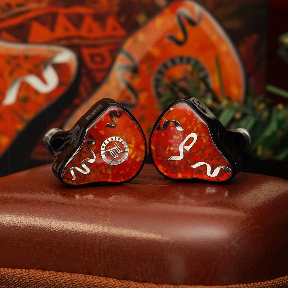 Juzear Fiesta pair resting on the leather case. Photo: Juzear Audio.