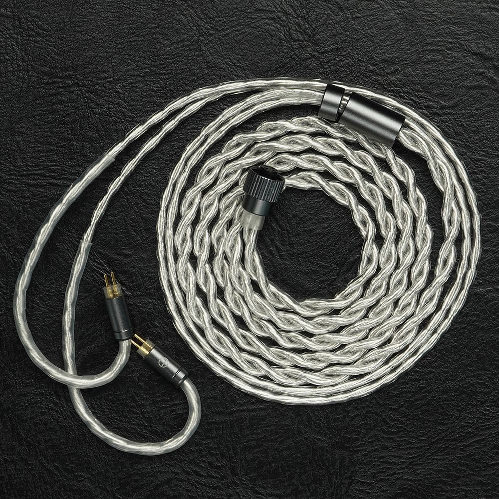 The coiled stock cable — 400-core, interchangeable plugs. Photo: Juzear Audio.